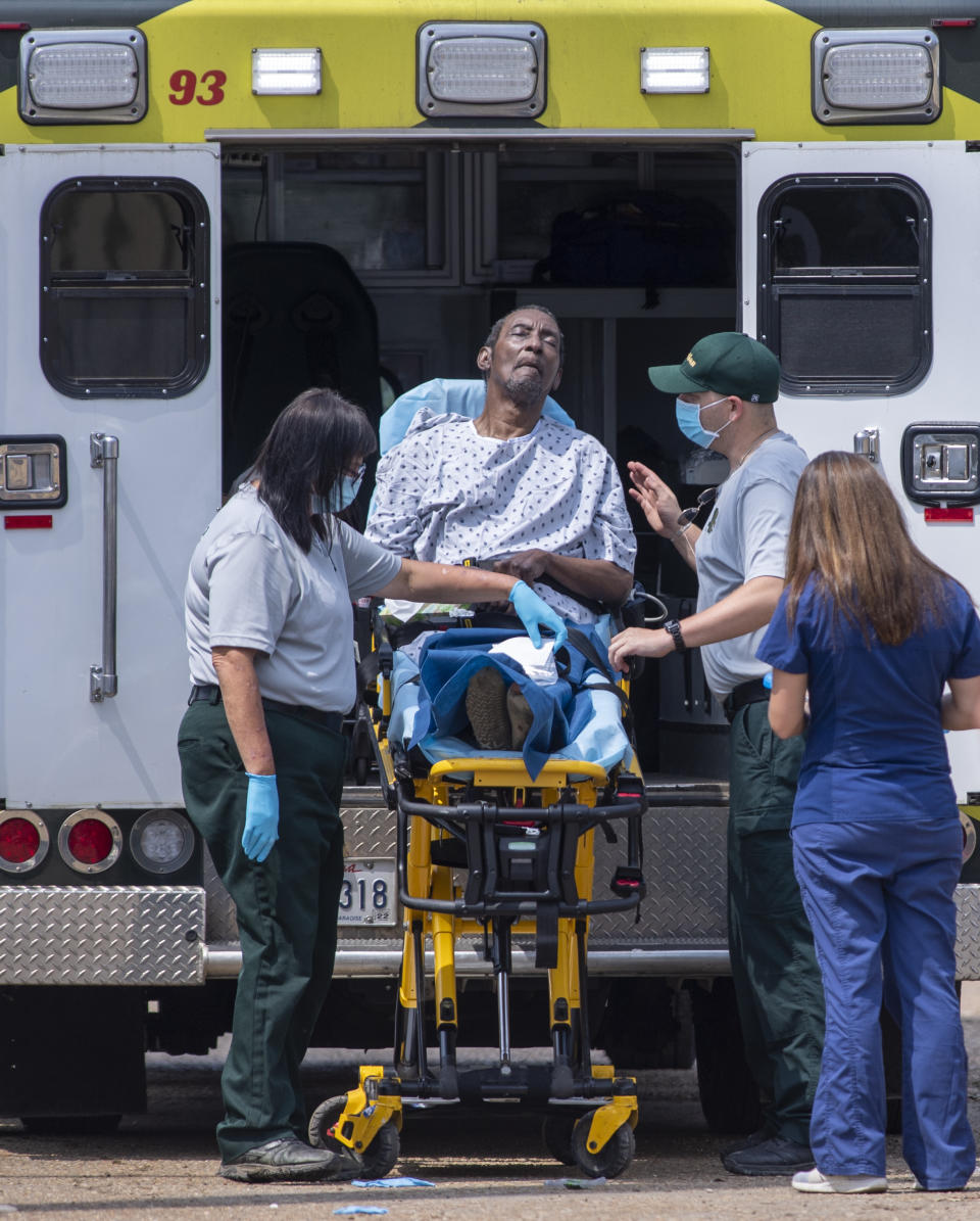 Emergency personnel evacuate people at a mass shelter Thursday, Sept. 2, 2021 in Independence, La. Multiple nursing home residents died after Hurricane Ida, but full details of their deaths are unknown because state health inspectors said Thursday that they were turned away from examining conditions at the facility to which they had been evacuated. (Chris Granger/The Times-Picayune/The New Orleans Advocate via AP)