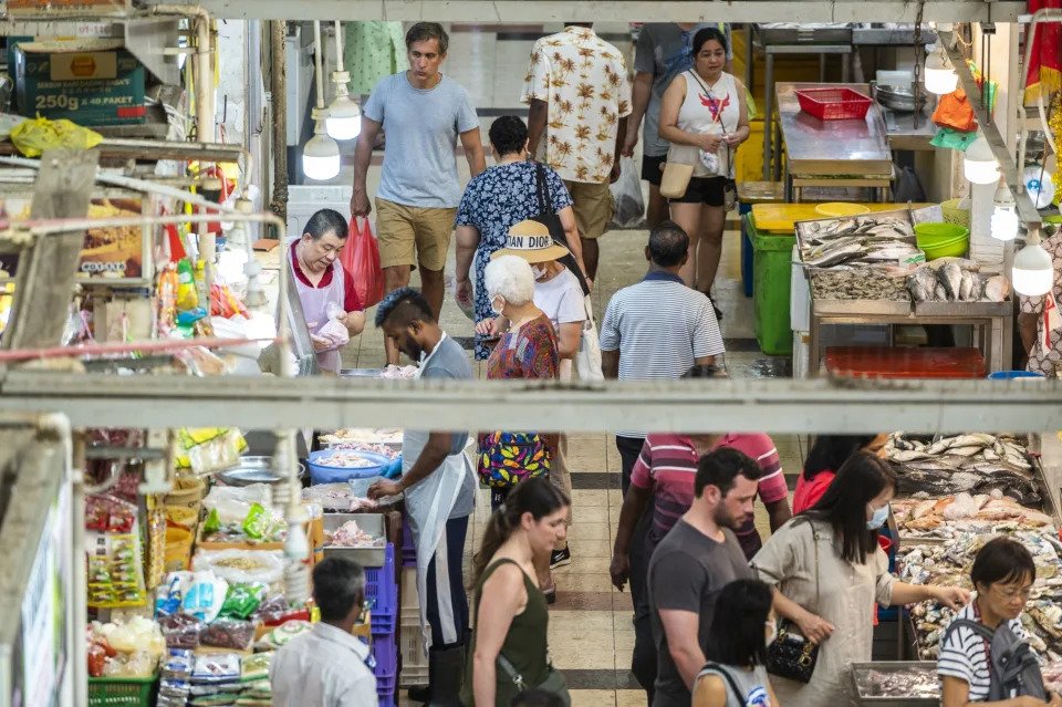 Customers browse for fresh produce at Tekka Center in Singapore, on Saturday, April 22, 2023. (Edwin Koo/Bloomberg)