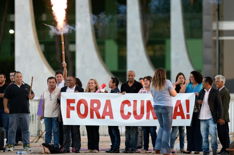 People celebrate the decision of the Supreme Court to suspend Eduardo Cunha, the speaker of Brazil's lower house of Congress, in Brasilia on May 5, 2016