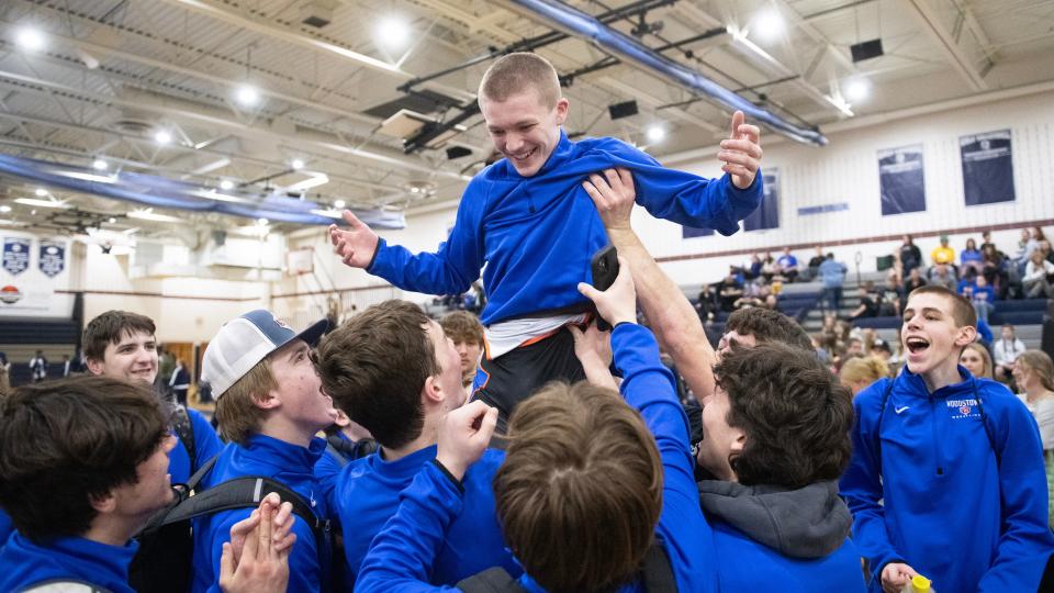 Woodstown's Travis Balback is carried by his teammates after Balback pinned Timber Creek's Matthew Steele during the 120 lb. bout of the wrestling meet held at Timber Creek High School on Friday, February 2, 2024.