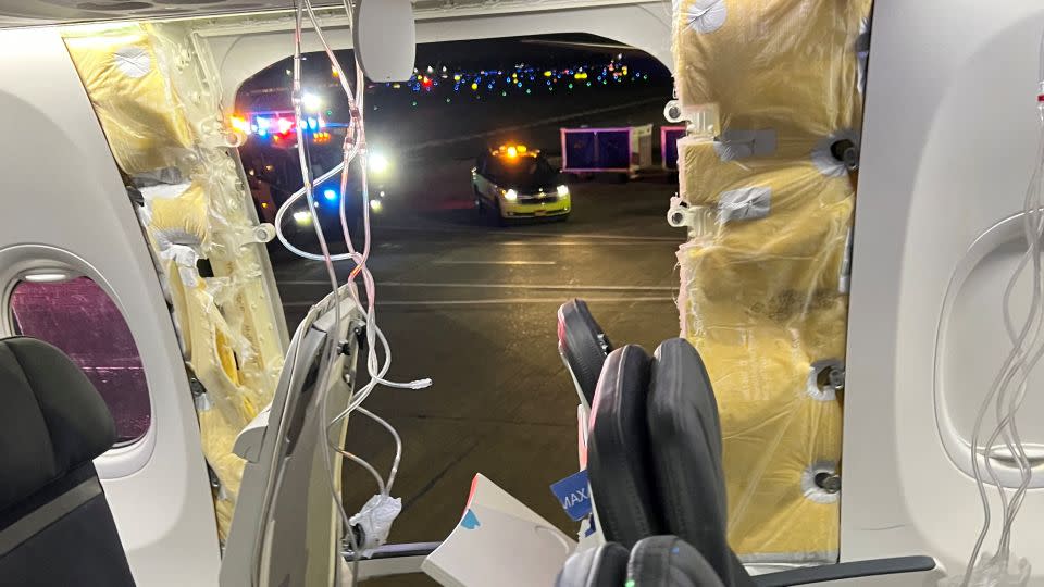 Oxygen masks hang near where part of a Boeing plane blew out during Alaska Airlines Flight 1282, which suffered depressurization soon after takeoff. - @strawberrvy/Instagram via Reuters