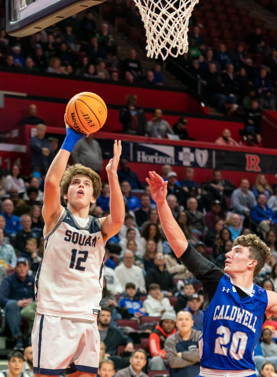 Manasquan's Griffin Linstra (12) goes for a layup against Caldwell in the NJSIAA Group 4 final on Saturday, March 4 2023 night at the Jersey Mike's Arena at Rutgers University in Piscataway.