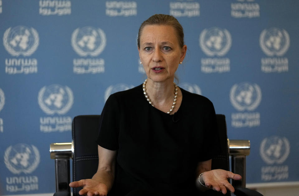 Dorothee Klaus, Director of UNRWA in Lebanon, speaks during an interview with the Associated Press, in Beirut, Lebanon, Friday, Aug. 4, 2023. Damages to the school complex in Lebanon's largest Palestinian refugee camp from clashes that erupted between factions in the camp over the past week could delay the start of the school year for some 6,000 children, the Lebanon head of the UN agency for Palestinian refugees said Friday. (AP Photo/Hussein Malla)