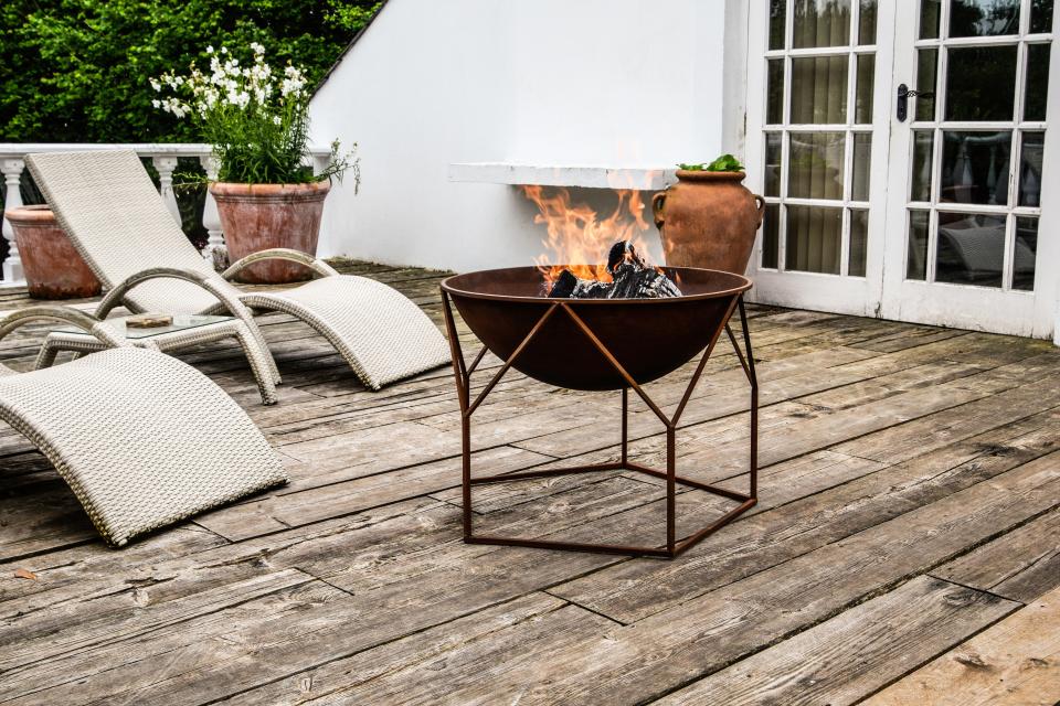 Love the vintage look? Consider a weathered fire pit