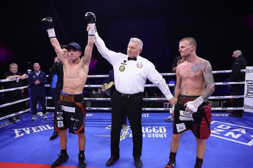 Peter McGrail has his hand raised after beating Mark Leach