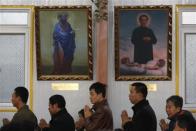 REFILE - CORRECTING SLUG Believers stand in a line to receive a communion during a weekend mass at an underground Catholic church in Tianjin November 10, 2013. REUTERS/Kim Kyung-Hoon