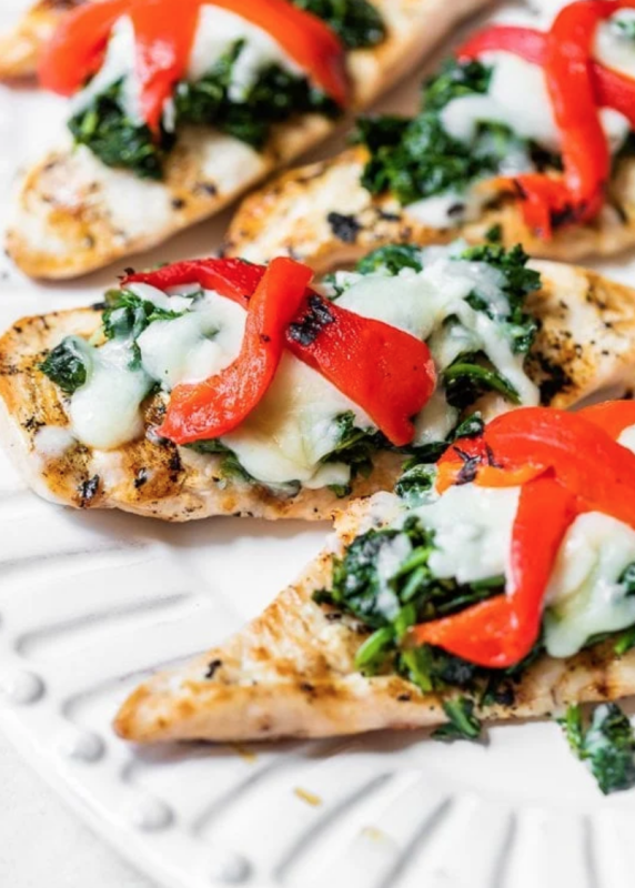 <p>Skinny Taste</p><p>Grilled chicken topped with spinach, melted mozzarella and roasted peppers – a quick and easy chicken dish your family will love!</p><p><strong>Get the recipe: <a href="https://www.skinnytaste.com/grilled-chicken-with-spinach-and-melted/" rel="nofollow noopener" target="_blank" data-ylk="slk:Grilled Chicken with Spinach and Melted Mozzarella;elm:context_link;itc:0;sec:content-canvas" class="link "><em>Grilled Chicken with Spinach and Melted Mozzarella</em></a></strong></p>