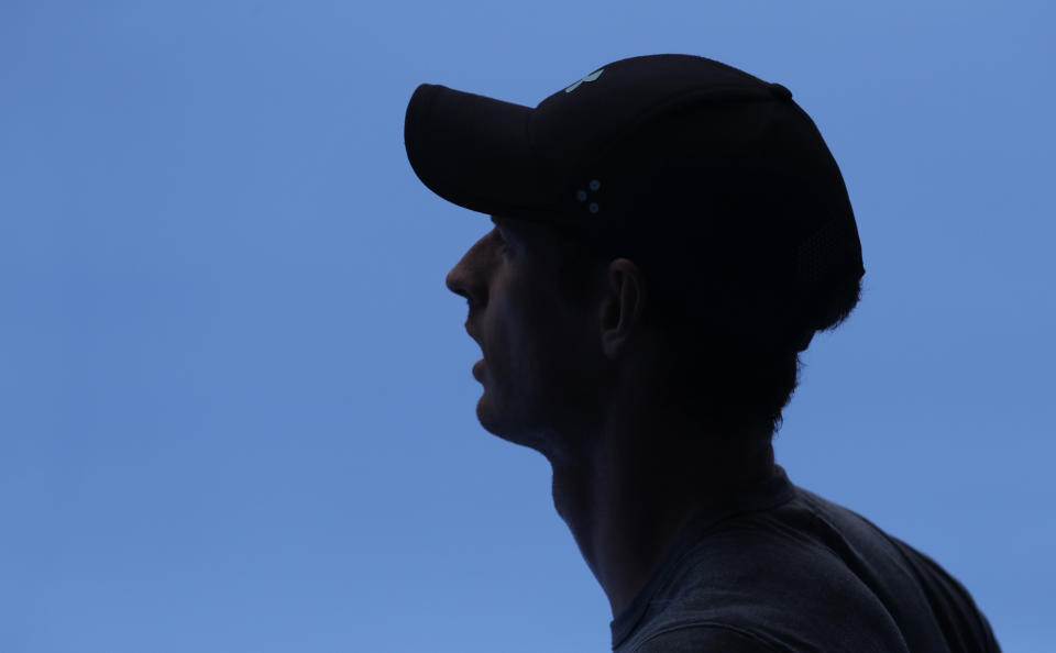 Britain's Andy Murray waits in the shade during his practice match against Serbia's Novak Djokovic on Margaret Court Arena ahead of the Australian Open tennis championships IN Melbourne, Australia, Thursday, Jan. 10, 2019. (AP Photo/Mark Baker)