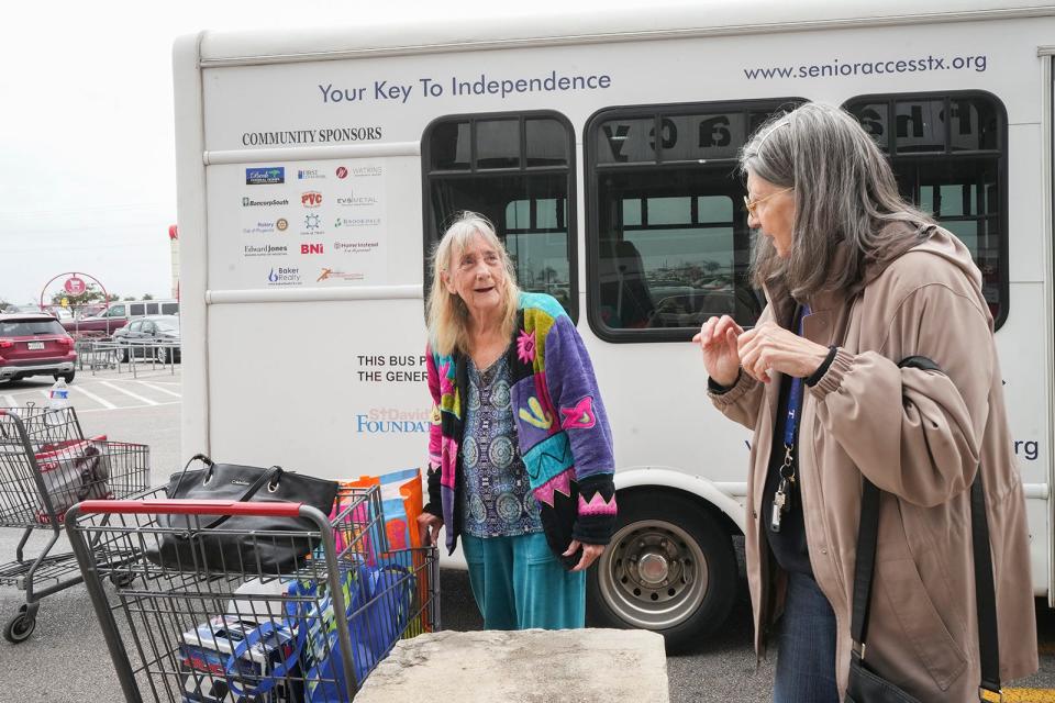 Carol Failing and Marilyn Horndt chat as they prepare to take the Senior Access van.