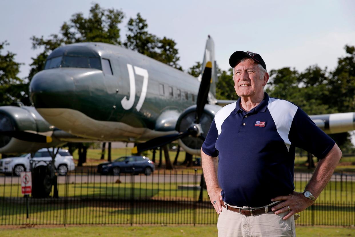 Gary Banz poses for a photo in front of a C-47 at Joe B. Barnes Regional Park in Midwest City, Okla., Saturday, May 28, 2022. Banz wrote and produced a documentary about the C-47 that was built at Tinker Air Force Base, used on D-Day, then restored before being put on display at Joe B. Barnes Regional Park in Midwest City.