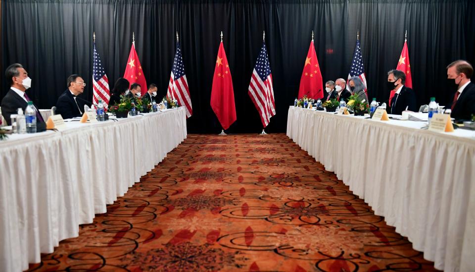 Secretary of State Antony Blinken, second from right, joined by national security adviser Jake Sullivan, right, speaks while facing Chinese Communist Party foreign affairs chief Yang Jiechi, second from left, and China's State Councilor Wang Yi, left, at the opening session of US-China talks at the Captain Cook Hotel in Anchorage, Alaska, Thursday, March 18, 2021.