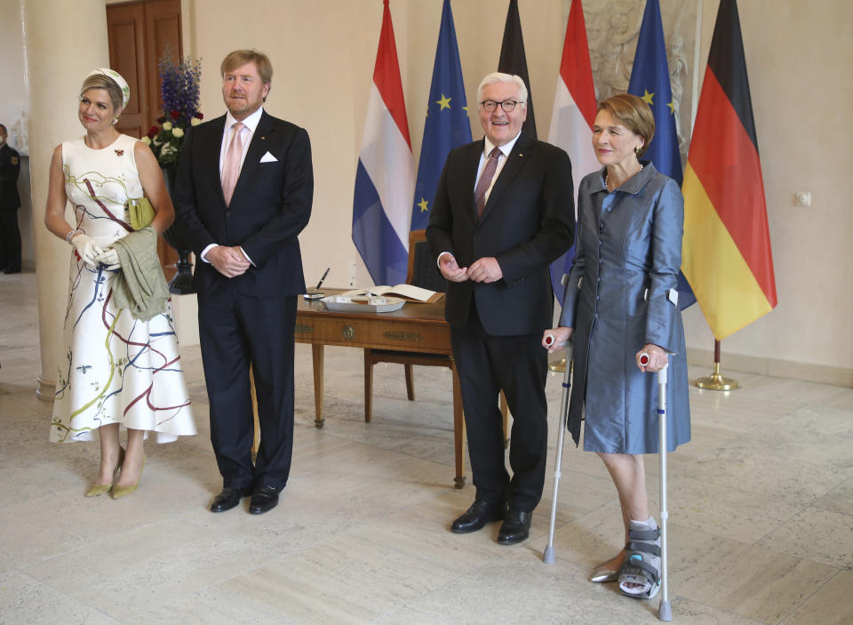 German president Frank-Walter Steinmeier, second right, and his wife Elke Buedenbender, right, welcome King Willem-Alexander of the Netherlands and Queen Maxima at the Bellevue palace in Berlin, Germany, Monday, July 5, 2021. The Royals arrived in Germany for a three-day visit that was delayed from last year because of the coronavirus pandemic. (Wolfgang Kumm/dpa via AP)