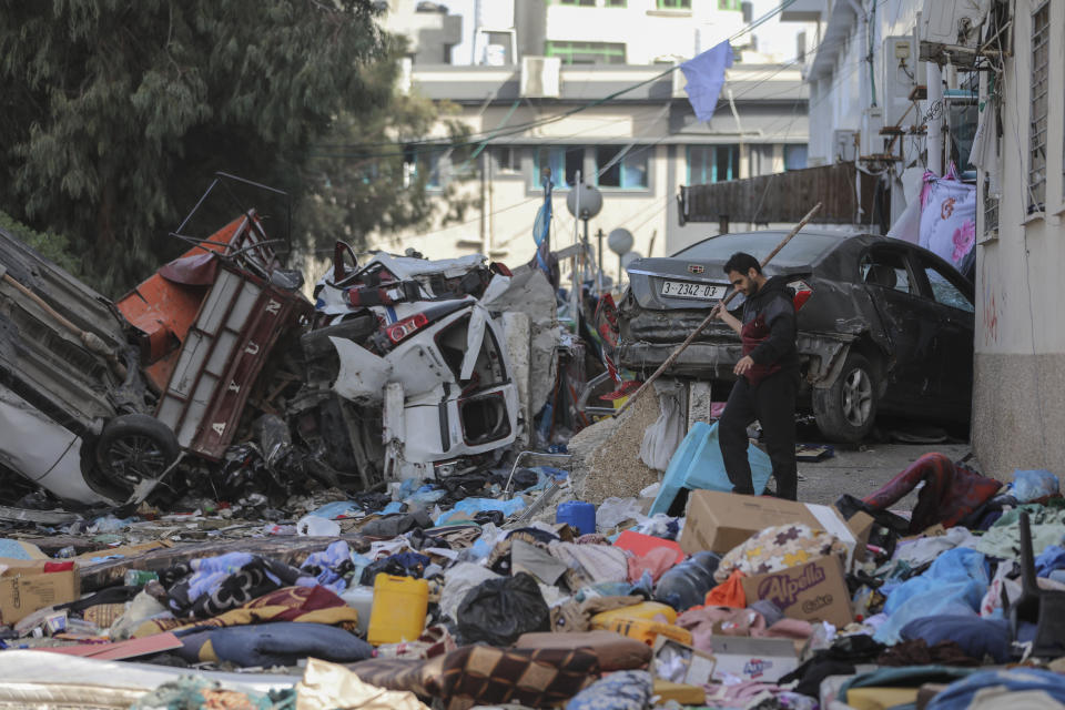 A Palestinian walks through Shifa Hospital grounds in Gaza City on Sunday, Nov. 26, 2023. on the third day of the temporary ceasefire between Hamas and Israel. (AP Photo/Mohammed Hajjar)