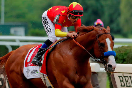 FILE PHOTO: Justify with jockey Mike Smith aboard wins the 150th running of the Belmont Stakes, the third leg of the Triple Crown of Thoroughbred Racing at Belmont Park in Elmont, New York, U.S., June 9, 2018. REUTERS/Lucas Jackson