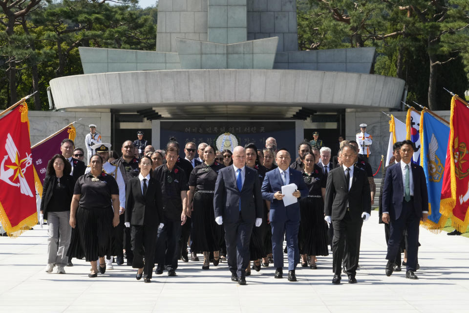 New Zealand's Prime Minister Christopher Luxon, center, leaves National Cemetery in Seoul, South Korea, Wednesday, Sept. 4, 2024. (AP Photo/Ahn Young-joon)