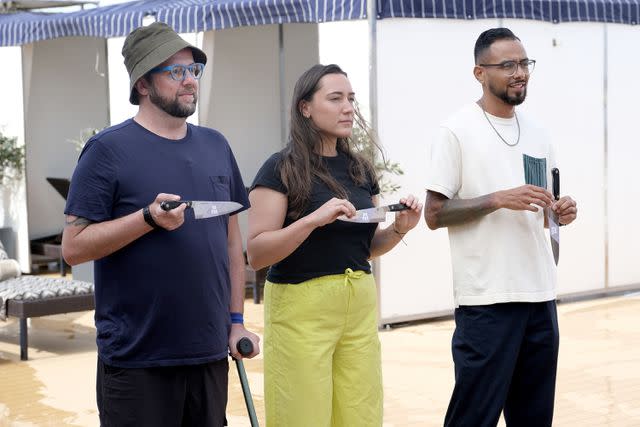 <p>David Moir / Bravo</p> Danny Garcia and Top Chef season 21 finalists Dan Jacobs and Savannah Miller draw knives during the finale.