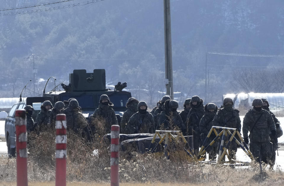 South Korean army soldiers move during a military exercise in Paju, South Korea, near the border with North Korea, Wednesday, Jan. 24, 2024. South Korea's military says North Korea fired several cruise missiles into waters off its western coast, adding to a provocative run of weapons demonstrations in the face of deepening nuclear tensions with the United States, South Korea and Japan. (AP Photo/Ahn Young-joon)