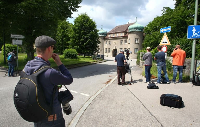 Journalists wait outside the prison in Landsberg am Lech, southern Germany, where Uli Hoeness, former president of German first division football club Bayern Munich, has been service a sentence for fraud