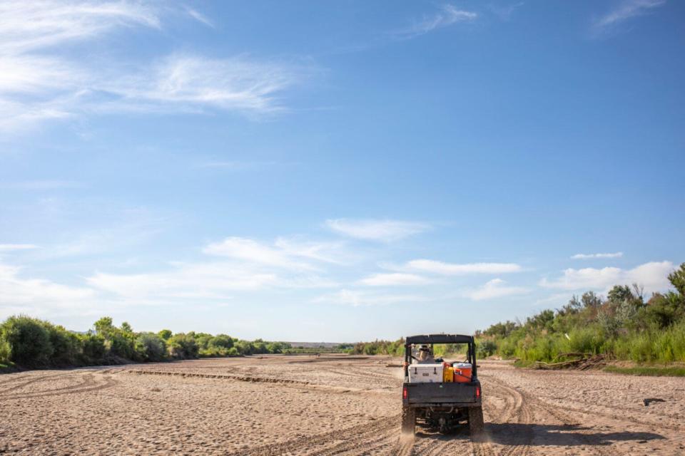 A vehicle in the dry riverbed of the Rio Grande. The San Acacia Reach is a stretch of the Rio Grande that has dried nearly every year for the past 25 years.