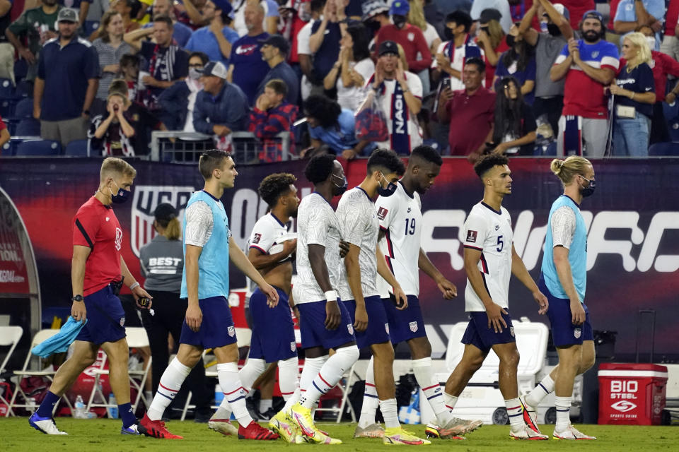 Members of the United States team leave the pitch following a 1-1 draw against Canada in a World Cup soccer qualifier Sunday, Sept. 5, 2021, in Nashville, Tenn. (AP Photo/Mark Humphrey)