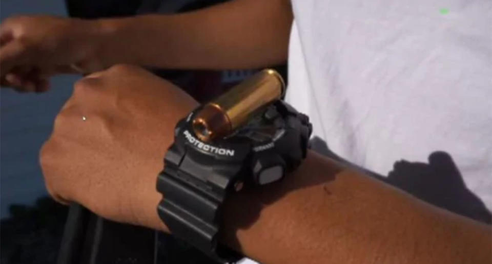 He can be seen comparing the bullet to his watch for scale. Source: Norman County Prosecutors Office