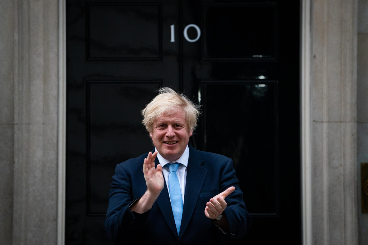 Prime Minister Boris Johnson stands in Downing Street, London, to join in the applause to salute local heroes during Thursday's nationwide Clap for Carers to recognise and support NHS workers and carers fighting the coronavirus pandemic.