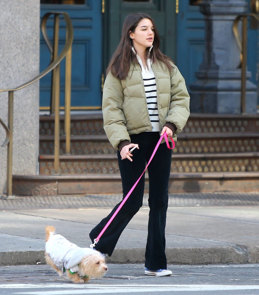 Suri Cruise walks her dog in SoHo in New York City on March 14, 2022. - Credit: AbacaPress / SplashNews.com