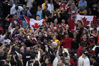 Fans and Toronto Raptors players celebrate after the Raptors defeated the Golden State Warriors 114-110 in Game 6 of basketball's NBA Finals in Oakland, Calif., Thursday, June 13, 2019. (AP Photo/Tony Avelar)