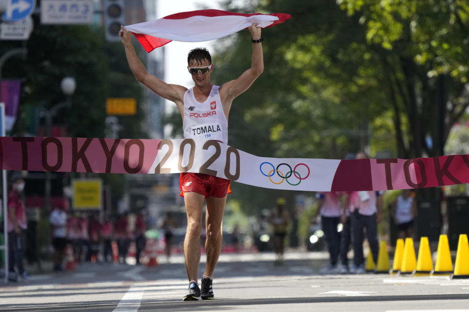 Dawid Tomala, of Poland, celebrates after placing first in the men's 50km race walk at the 2020 Summer Olympics, Friday, Aug. 6, 2021, in Sapporo, Japan. (AP Photo/Shuji Kajiyama)