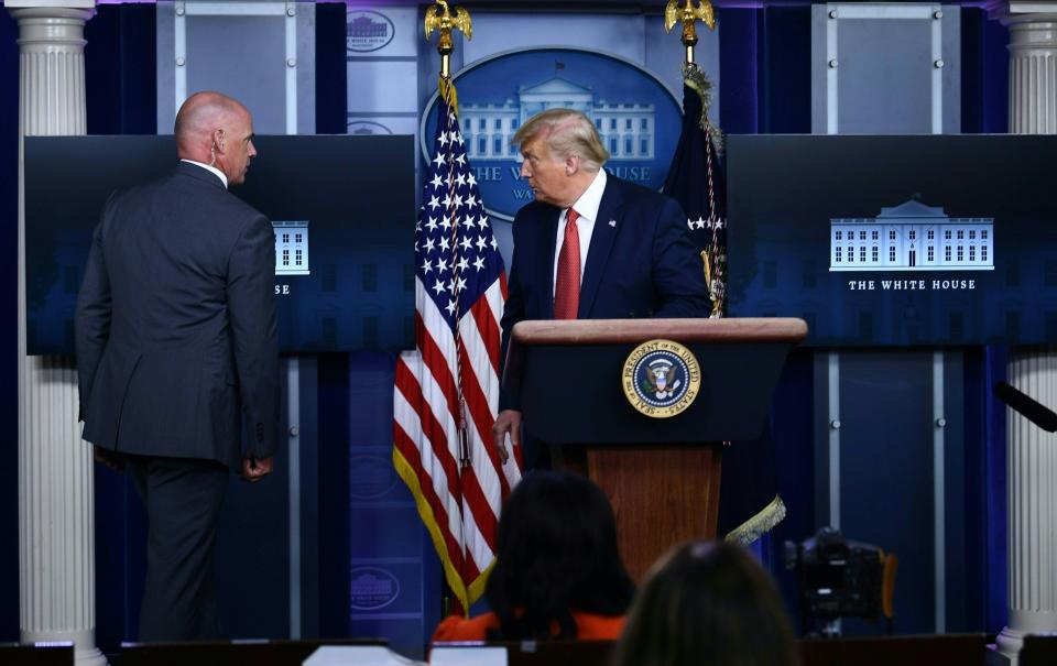 US President Donald Trump is being removed from the Brady Briefing Room of the White House in Washington, DC, on August 10, 2020.