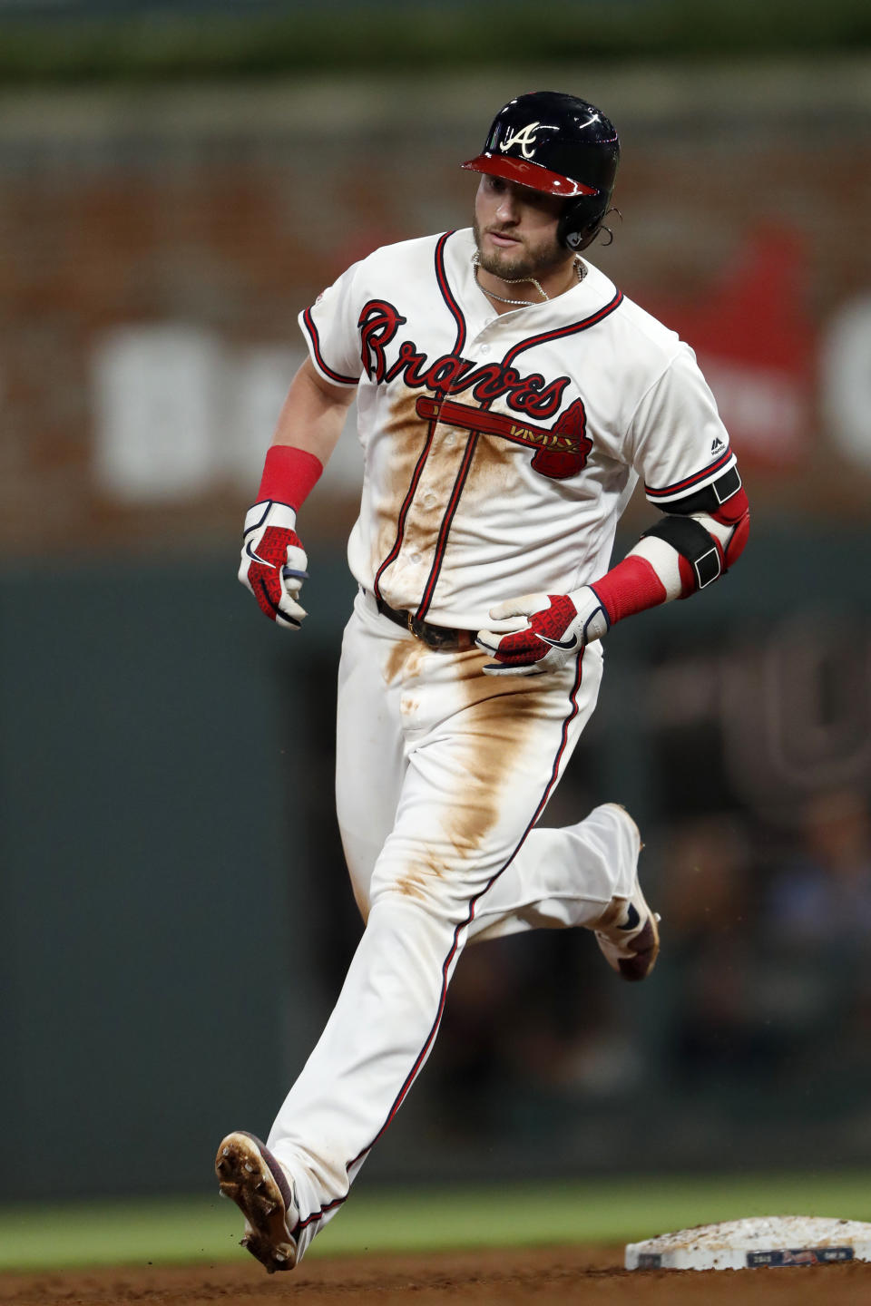 Atlanta Braves' Josh Donaldson rounds the bases after hitting a solo home run in the sixth inning of a baseball game against the Los Angeles Dodgers, Saturday, Aug. 17, 2019, in Atlanta. (AP Photo/John Bazemore)