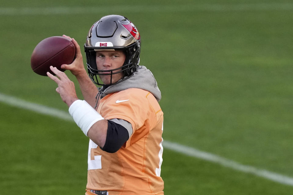 Tampa Bay Buccaneers quarterback Tom Brady throws a ball during a practice session in Munich, Germany, Friday, Nov. 11, 2022. The Tampa Bay Buccaneers are set to play the Seattle Seahawks in an NFL game at the Allianz Arena in Munich on Sunday. (AP Photo/Matthias Schrader)