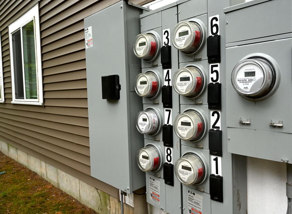 A bank of electric meters in May 2022.