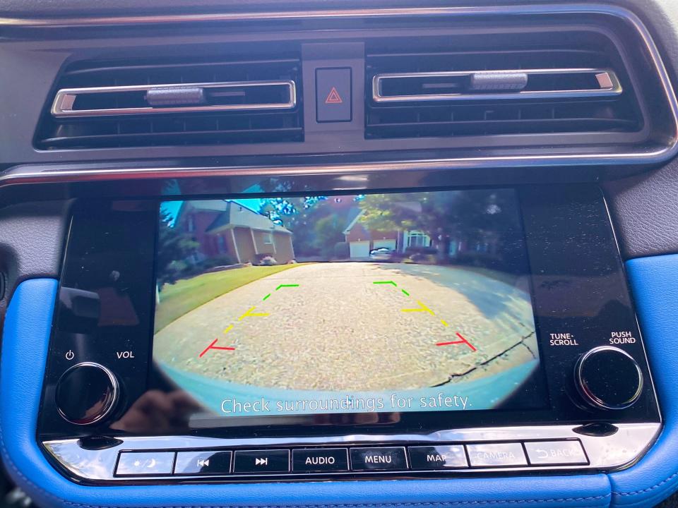 The rearview camera is displayed on the Nissan Z's infotainment screen.