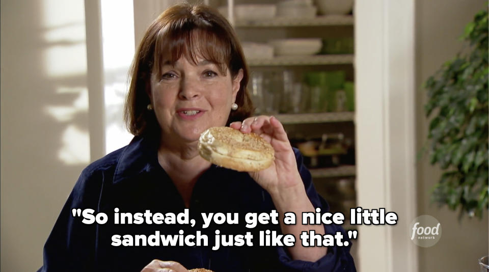 Ina Garten smiles at the camera, holding a bagel