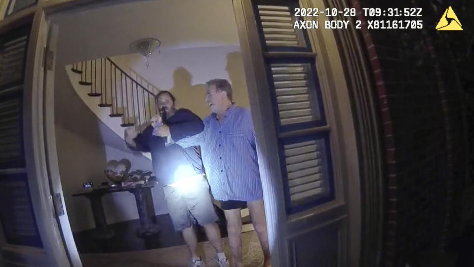 This image from video from police body-worn camera footage, released by the San Francisco Police Department, shows Paul Pelosi, right, fighting for control of a hammer with his assailant, David DePape, during a attack at Pelosi's home in San Francisco on Oct. 28, 2022. DePape wrests the tool from Pelosi and lunges toward him the hammer over his head. The blow to Pelosi occurs out of view of the video as officers rush into the house and subdue DePape. (San Francisco Police Department via AP)