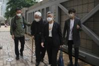 From left, Hong Kong scholar Hui Po-keung, Catholic Cardinal Joseph Zen, barrister Margaret Ng and singer Denise Ho arrive for an appearance at a court in Hong Kong as they were charged in relation to their past fundraising for activists, Tuesday, May 24, 2022. (AP Photo/Kin Cheung)