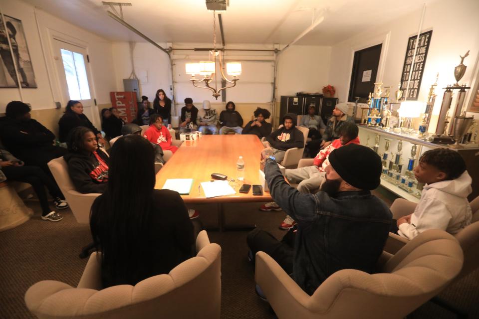 From left, cosmetologist Shaliah Johnson and Stylez Da Barber talk to their students and parents for their upcoming classes on barbering and cosmetology during a meet and greet on April 5, 2023.