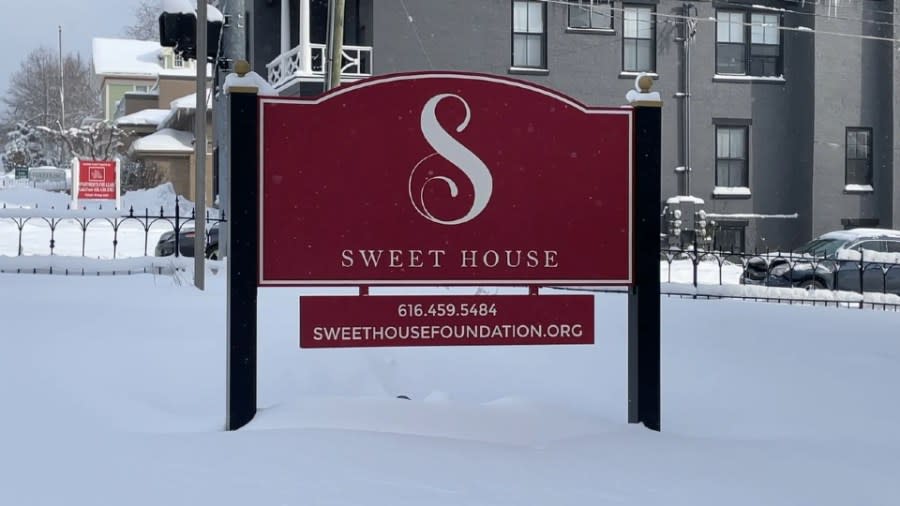 A dark-red sign reads "Sweet House".