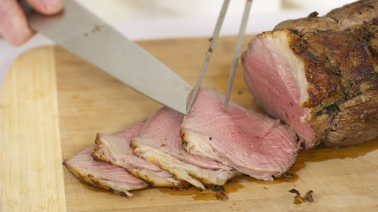 chef slicing roast beef