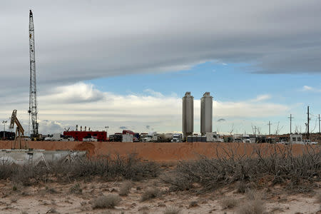 A fracking site operated by Exxon is seen near Carlsbad, New Mexico, U.S. February 11, 2019. Picture taken February 11, 2019. To match Insight USA-SHALE/MAJORS REUTERS/Nick Oxford