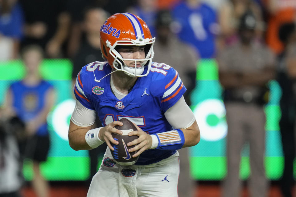 Florida quarterback Graham Mertz looks for a receiver against Central Florida during the first half of an NCAA college football game, Saturday, Oct. 5, 2024, in Gainesville, Fla. (AP Photo/John Raoux)