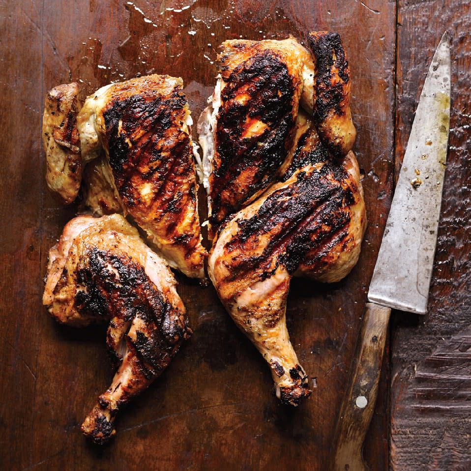 Flattening your chicken before grilling, and holding it that way with two bricks (wrapped in foil), means a chicken that cooks more evenly—with lots of delightfully crispy skin. Serve with garlicky <a href="https://www.epicurious.com/recipes/food/views/aioli-107026?mbid=synd_yahoo_rss" rel="nofollow noopener" target="_blank" data-ylk="slk:aioli;elm:context_link;itc:0" class="link ">aioli</a> or <a href="https://www.epicurious.com/recipes/food/views/romesco-sauce-51140680?mbid=synd_yahoo_rss" rel="nofollow noopener" target="_blank" data-ylk="slk:romesco;elm:context_link;itc:0" class="link ">romesco</a> and <a href="https://www.epicurious.com/recipes/food/views/german-potato-salad-with-dill-51236500?mbid=synd_yahoo_rss" rel="nofollow noopener" target="_blank" data-ylk="slk:potato salad;elm:context_link;itc:0" class="link ">potato salad</a>. <a href="https://www.epicurious.com/recipes/food/views/chicken-under-a-brick-51175280?mbid=synd_yahoo_rss" rel="nofollow noopener" target="_blank" data-ylk="slk:See recipe.;elm:context_link;itc:0" class="link ">See recipe.</a>