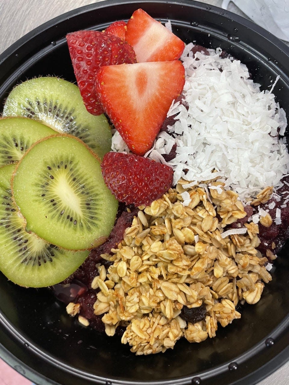 The acaí bowl comes with four toppings of choice at Beach Bowls.