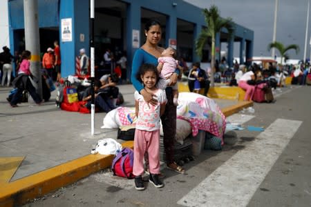 The Wider Image: Venezuelan mothers, children in tow, rush to migrate