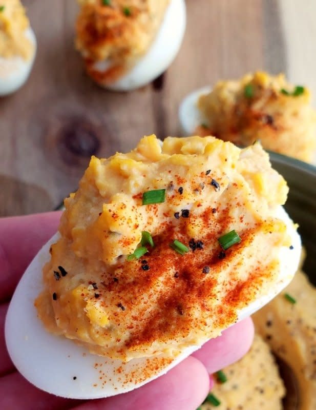 <p>Noble Pig</p><p>Add a little spice to the appetizer table with Sriracha mayo deviled eggs. This is a zesty, creamy and splurge-worthy treat you’ll want to serve at every event!</p><p><strong>Get the recipe: <a href="https://noblepig.com/2018/11/sriracha-mayo-deviled-eggs/" rel="nofollow noopener" target="_blank" data-ylk="slk:Sriracha Mayo Deviled Eggs;elm:context_link;itc:0;sec:content-canvas" class="link ">Sriracha Mayo Deviled Eggs</a></strong></p>