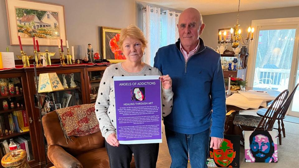 PHOTO: Anne Marie and Jim Zanfagna hold a poster about their organization, Angels of Addictions, in their Plaistow, N.H. home, Jan. 22, 2024. (ABC News )