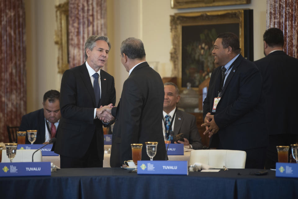 Secretary of State Antony Blinken, left, greets dignitaries from Pacific Island Countries during the U.S.-Pacific Island Country Summit at the State Department in Washington on Wednesday, Sept. 28, 2022. (AP Photo/Kevin Wolf)