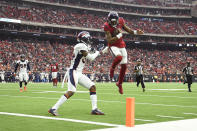 Houston Texans quarterback Deshaun Watson (4) leaps over Denver Broncos strong safety Will Parks (34) for a touchdown during the second half of an NFL football game Sunday, Dec. 8, 2019, in Houston. (AP Photo/Eric Christian Smith)