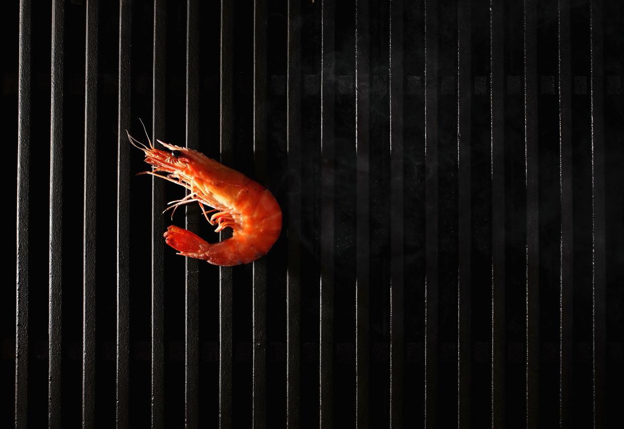 SYDNEY, NSW - JANUARY 25:  A king prawn cooks on a barbeque January 24, 2006 in Sydney Australia. Australian comedian Paul 